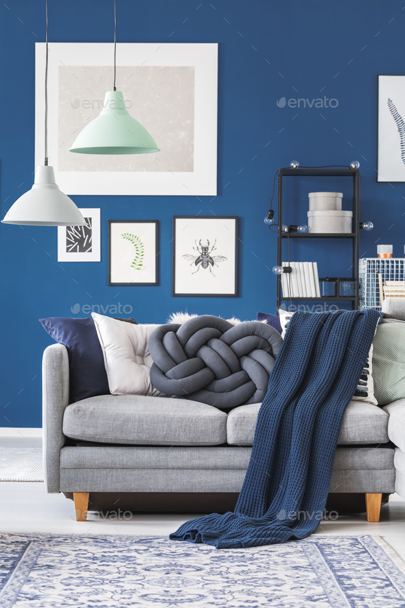 Blue blanket on grey sofa